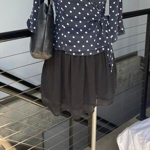 Black mini skirt with a flowy design